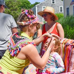 Celia Waldman, 3, gets her face painted. 