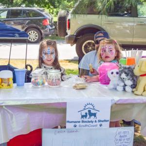 Hannah Nadeau, 5, and Romyn Silva, 4 and a half, sell lemonade to raise money for the shelter. 