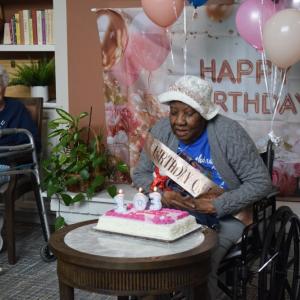 Nellie Jackson blows out the candles on her cake. Photos by Kat Sheridan