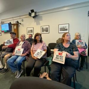 Residents with their signs. Photo by Kat Sheridan