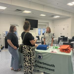 Guests go to the Naloxone training table. 