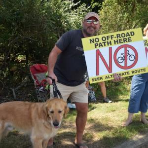 Jeff Rousseau protested with his dog. 
