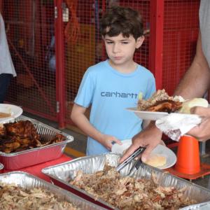 Adam, 8, debates if he wants some chicken. 