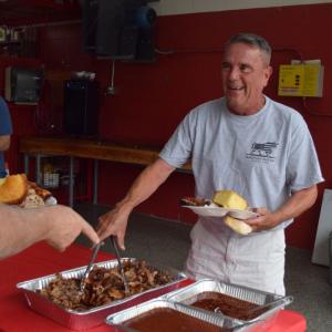 A man enjoys the buffet-style lunch. 