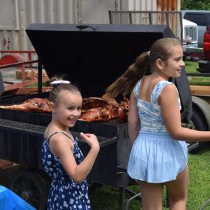 Charlotte O'Connor and Georgia Seland try and get their friend to come look at the whole pig. 