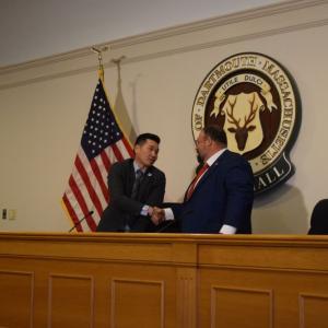 Chester Tam and Henry Bousquet shake hands at the end of the debate. Photos by Kat Sheridan