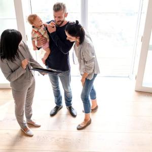 A photo of a family and a realtor. 