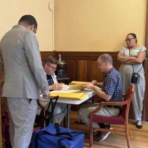 Some of the workers performing the recount in New Bedford. 