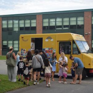 Kids line up for ice cream. 