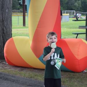 Dayton Lewis, age 6, enjoys a Shrek ice-cream bar. 