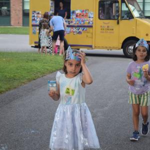 Claire and Ruby, both 5, enjoy some ice cream. 
