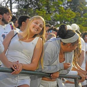 A student dressed in white. 