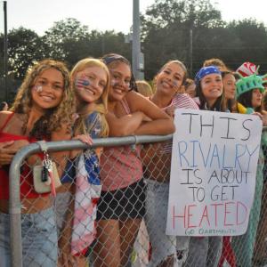 Dartmouth students with a sign for the Battle. 