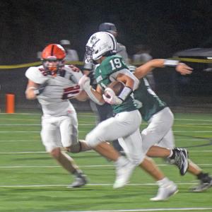 Chace Powers runs for a touchdown. 