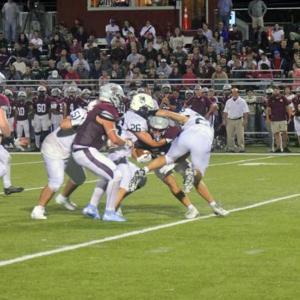 A Bishop Stang player gets tackled. 