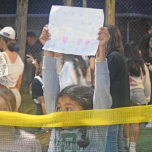 Naki Pachico cheers for her brother Dylan, who made the first touchdown. 