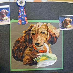 A quilt showing one of Nina's dachshunds. 