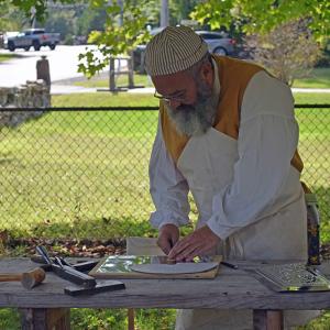 John Garcia shows engraving techniques. 