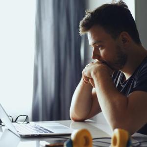 A person looking at his laptop. 
