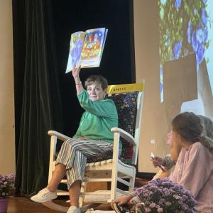 Tavares reads The Birthday Queen to the students. 