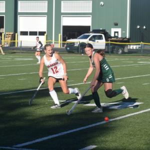 A Dartmouth and Barnstable player race for the ball. 