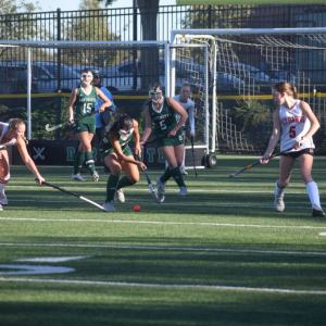A number of players head for the ball. 