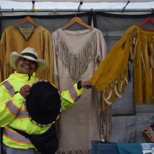 Patricia S'Ochepo Sutton with the traditional clothing she makes. 