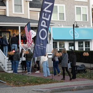 A crowd formed outside Padanaram Outfitters for a drink. 
