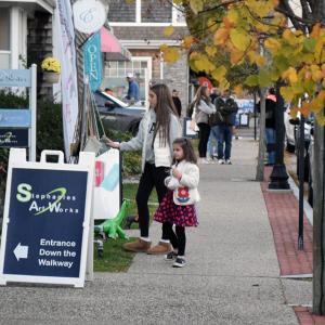 Zoe Williamson (14) and Liliana Fournier (4) explore the goods. 