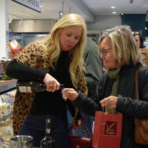 Judie and Hallee try wine paired with cheese. 