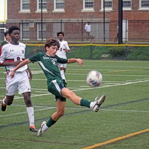 Casey Martinho keeps the ball from going out of bounds. Photos by Kat Sheridan