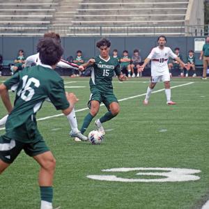 Kaleb Medeiros attempts to get the ball from an opposing player. 