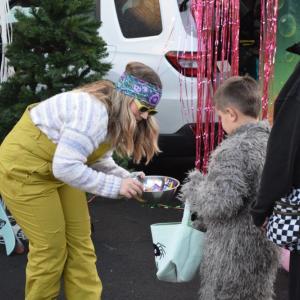 Jessica Dastous hands some candy to Sean (6) dressed as the big bad wolf. 