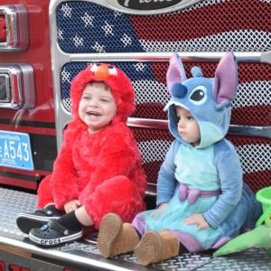Wesley (2) and Taytum (1.5) dressed up as Elmo and Stitch. 