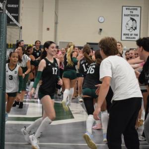The students run past their friends for high fives. Photos by Kat Sheridan