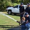 Jeremy McNamera and his son Bennett, spray a fire hose. Photos by Kat Sheridan