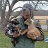 Shannon Lawrence snuggles with the baby goats. Photos by Kat Sheridan