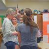 Students present their project to Elizabeth Coughlin. 