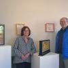 Susan Medyn and David Formanek pose in front of some of their art. Photos by Kat Sheridan