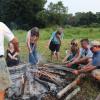 A group roasts hot dogs around the fire. Photos by Kat Sheridan