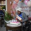 Nellie Jackson blows out the candles on her cake. Photos by Kat Sheridan
