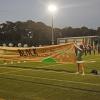 The banner stating the motto of the game, "White out the stands, black out the score board." Photos by Kat Sheridan