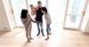 A photo of a family and a realtor. 
