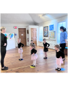 Young dancers wait for instruction from Miss Tess.